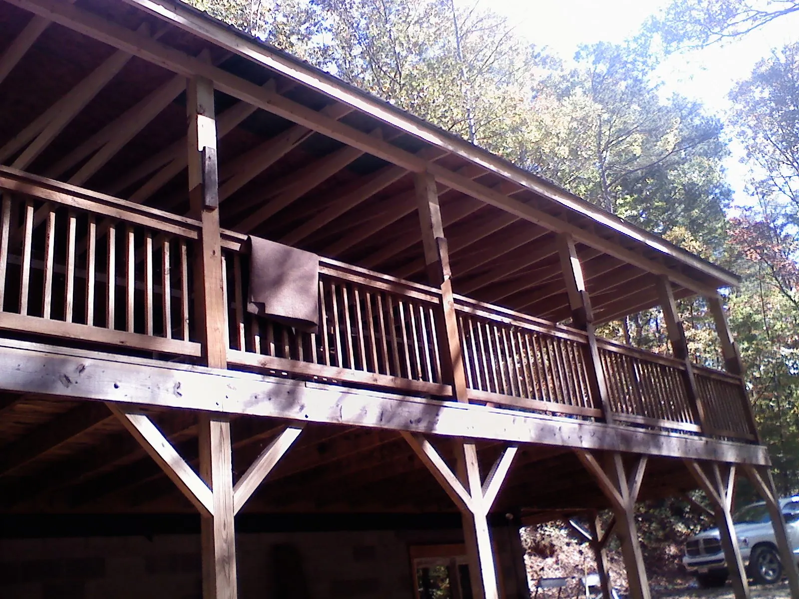 Timber framing under a new elevated porch and deck — Roof Leak Repair in Southbridge by Roofing Brothers